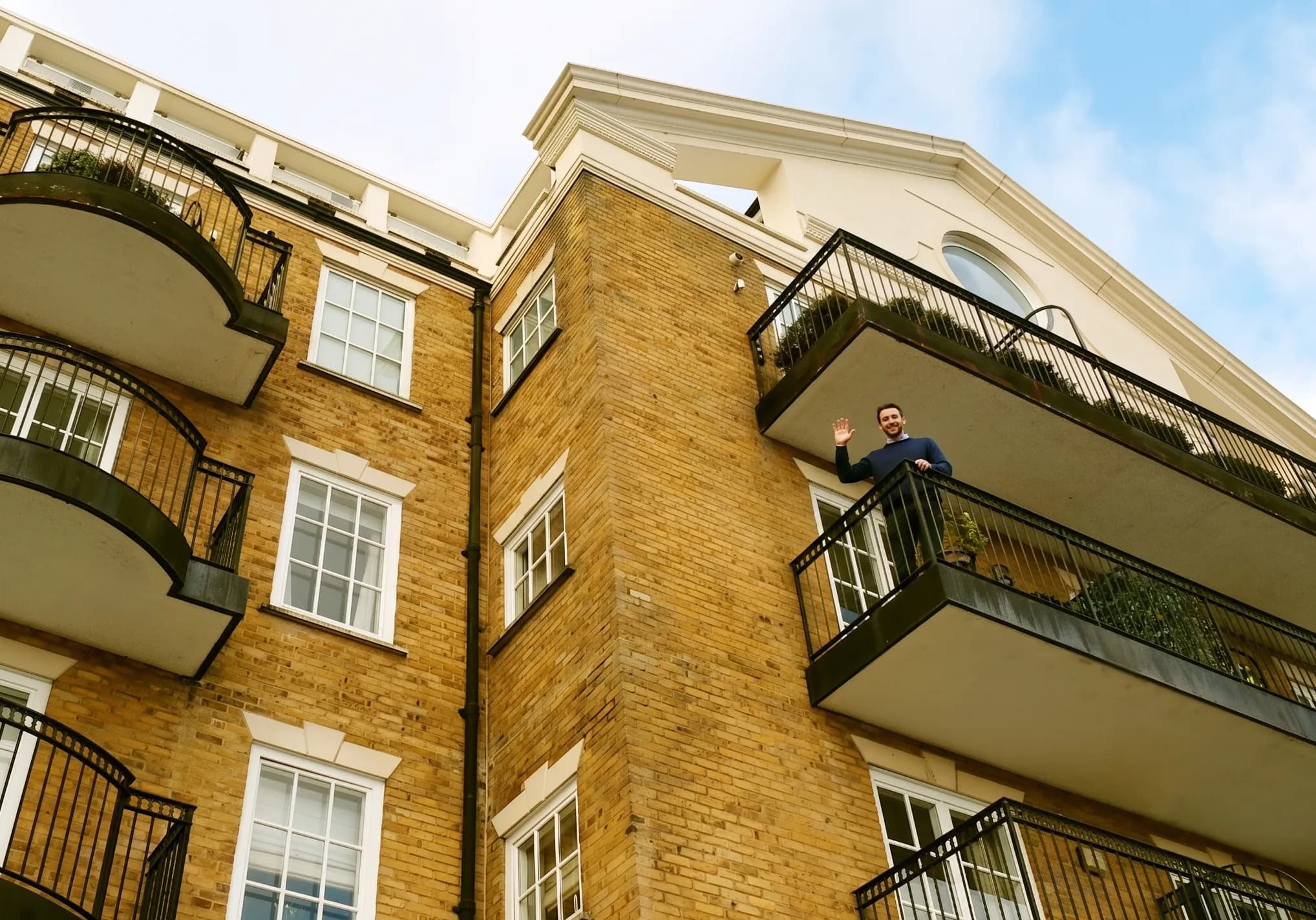 Residents and people in a UK residential setting, representing community-led block management